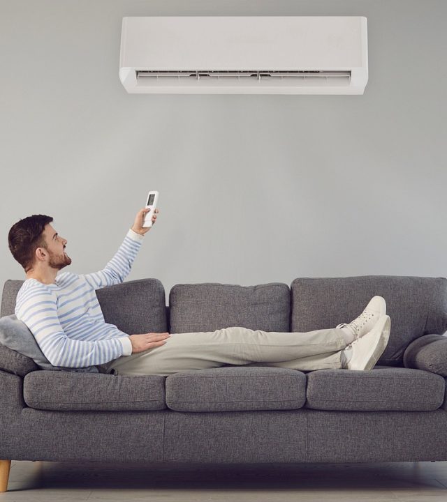 air conditioner, man, sofa-7267527.jpg